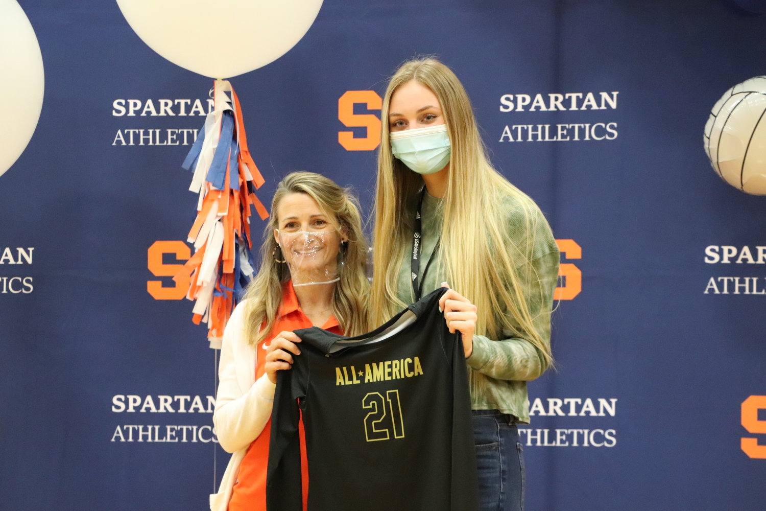 Seven Lakes senior outside hitter Ally Batenhorst and Spartans coach Amy Cataline pose for a photo after Batenhorst was awarded her Under Armour All-American jersey on Wednesday morning after being selected as one of 11 players to the first team.